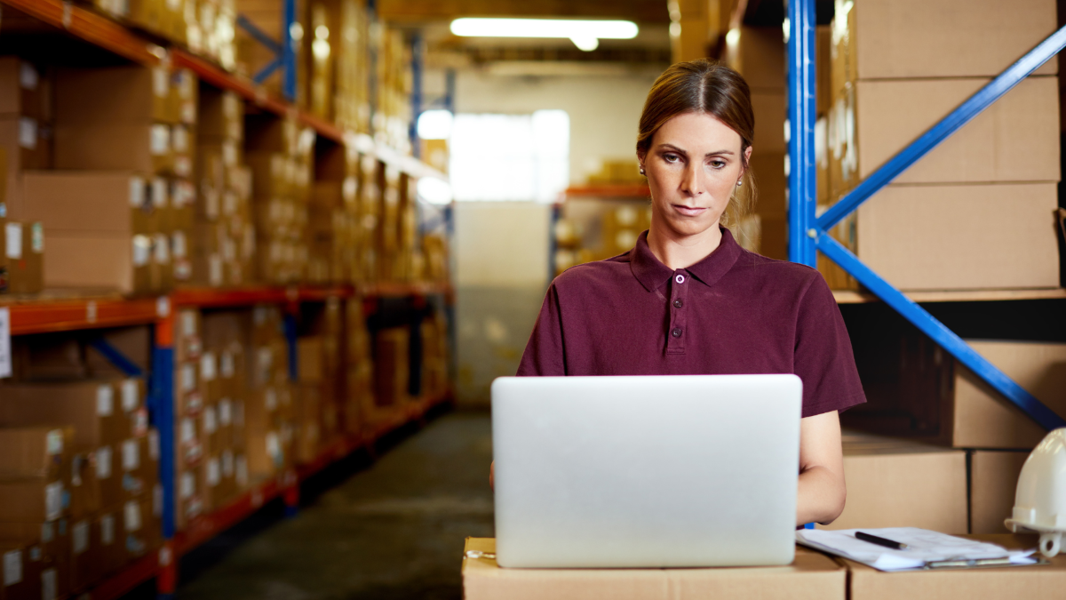 woman working on computer to verify supplier records